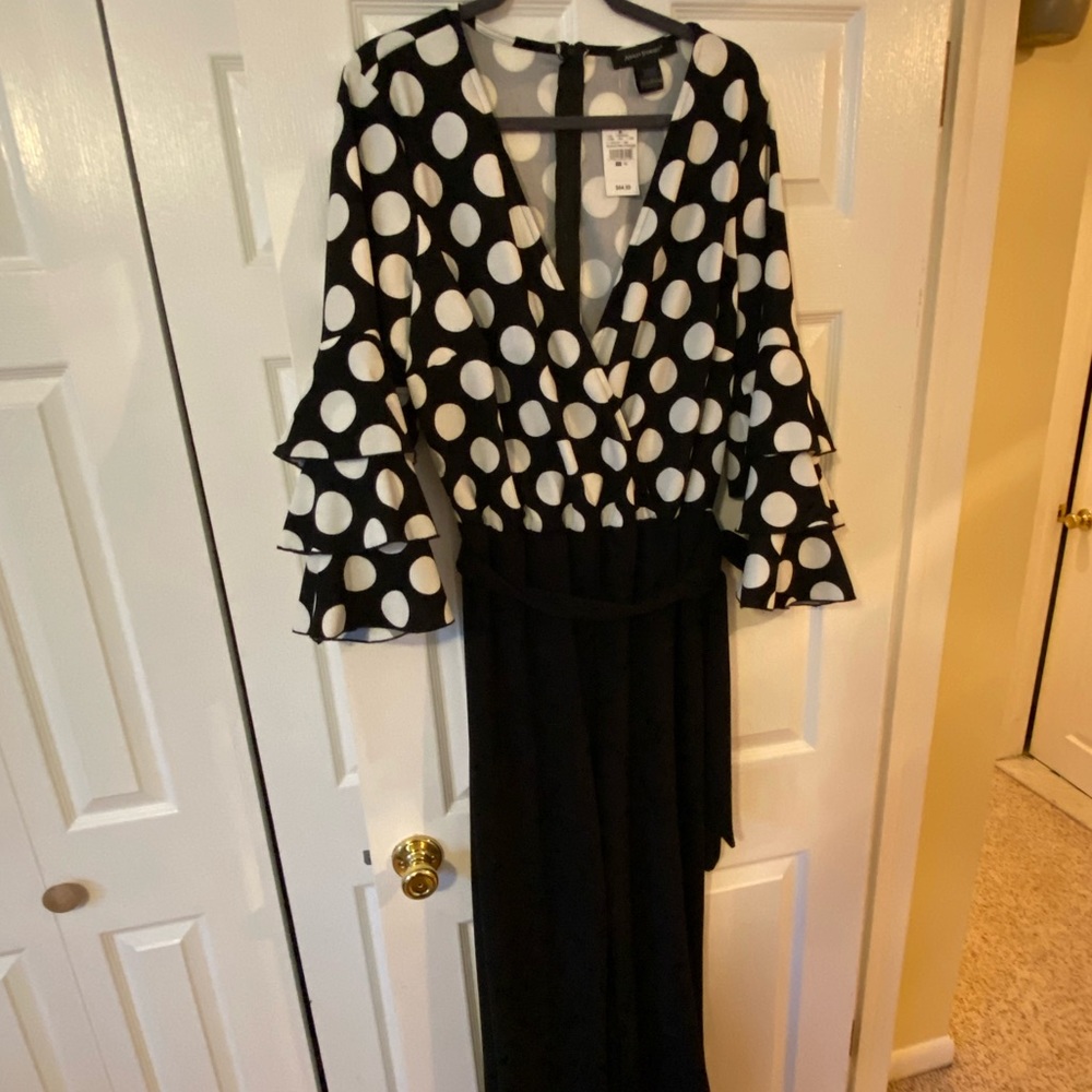 Black & white polkadot jumpsuit with ruffled sleeves- Size 18.